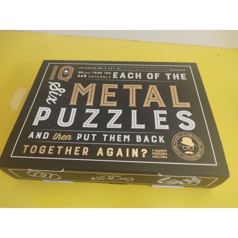 Six Metal puzzles by IQ Original Hand Made Puzzles